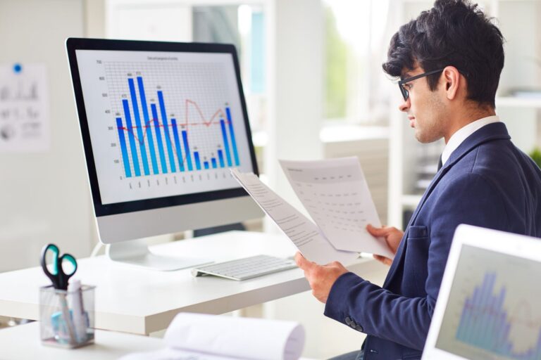Statistician reviewing analysis charts for SAPs and TLFs