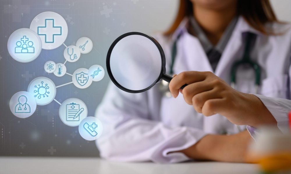 Doctor holding magnifying glass with medical and healthcare Icons. Medical check up concept.